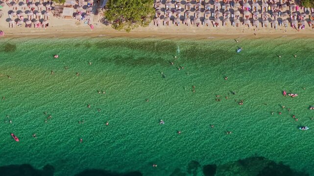 Crowded Sandy Shore of Paralia Pachi Beach, Thasos, Greece