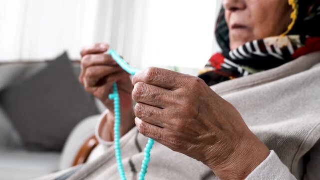 Elderly Person Holding Prayer Beads Close-Up Spiritual and Calm Lifestyle