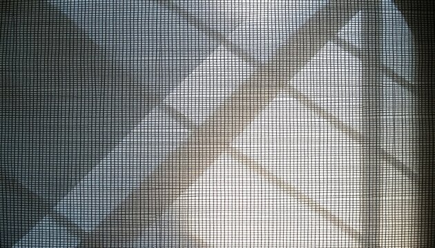 Abstract light filtering through a fine mesh grid for backgrounds and design elements