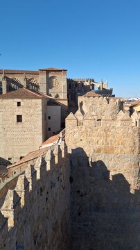 High angle view of the historic medieval walls of Avila, Spain, on a sunny day