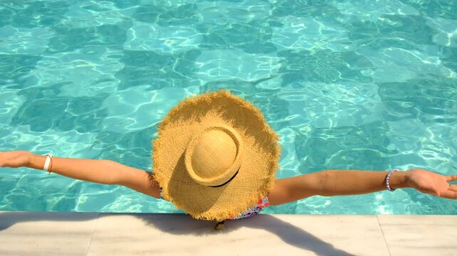 Woman in hat in swimming pool. selective focus.