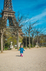 Obraz premium Children in Paris near the Eiffel Tower. Selective focus.