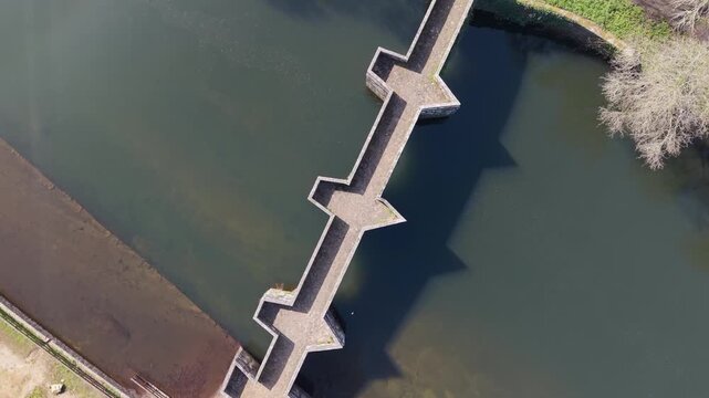 Top View Of Brandomil Historic Stone Bridge In Zas, Spain. Aerial Ascending Shot