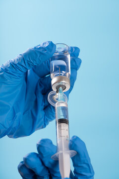 Healthcare worker preparing vaccine or medicine for injection