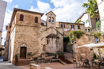 Fototapeta premium Exterior of the Church of Santi Stefano e Valentino, a small Romanesque church documented since 1163, with a saddle bell tower restored in 1936, on Via dei Priori, Perugia, Umbria, Italy.