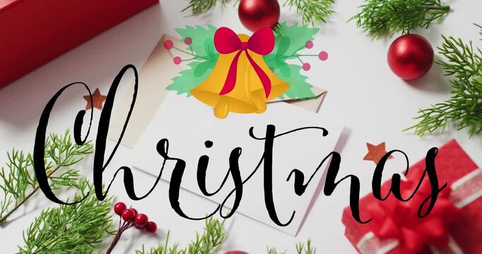 Animation of christmas text over christmas decorations and envelopes