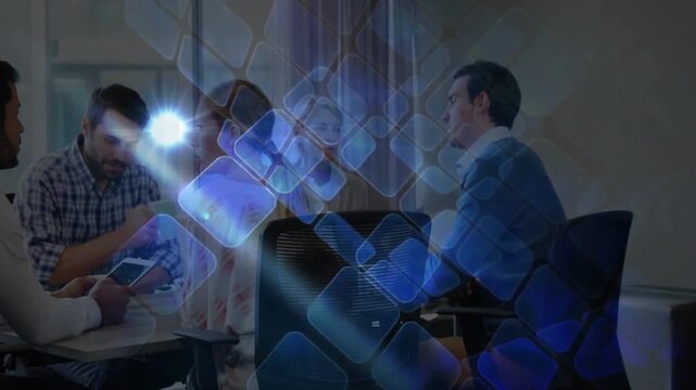 Business colleagues tapping tablet activating blue grid overlay while team exploring chart data
