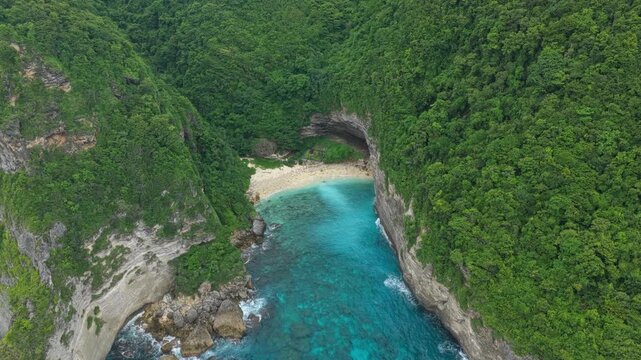 Aerial drone flying over sunfish beach on nusa penida island