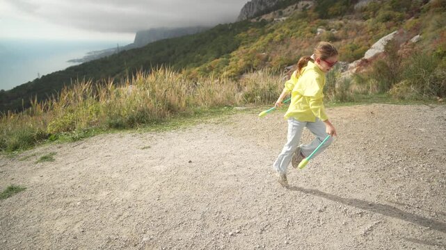 Flexible Acrobatic Skill Young Girl Practicing Gymnastics With Clubs On Mountain Road Vertical video