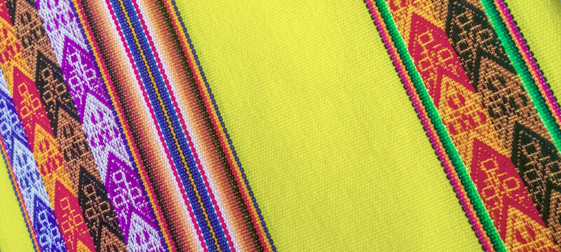 Colorful background of traditional textile fabric, Peru, Latin America, Colorful typical Peruvian hand-woven fabric.