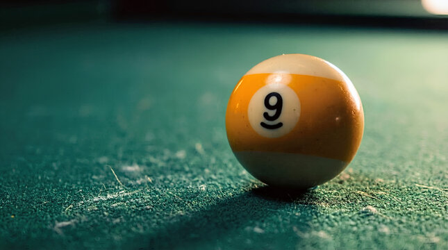Yellow 9 Ball on Green Felt Pool Table Macro Close Up