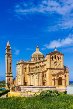 Sunny Mediterranean Stone Cathedral With Dome and Bell Tower Over Coastal Landscape