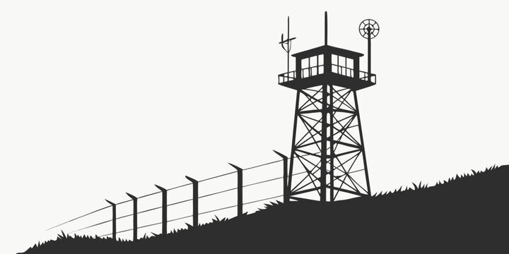 A tall metal watchtower with a fence next to it