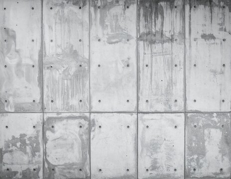 Aged concrete wall texture with stains and panel pattern, grunge industrial background