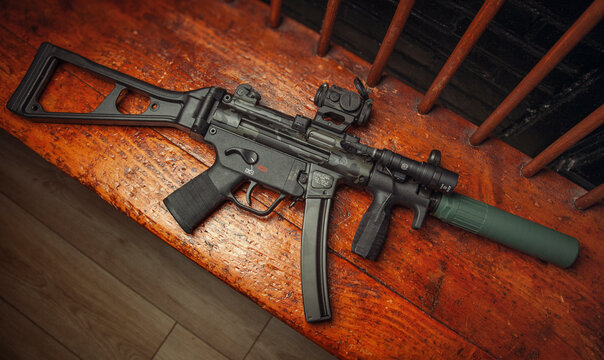 Heckler & Koch SP5K, 9mm submachine gun. Limited edition Cerakote paint, Aimpoint T-2 Micro Red dot sight. CAT MOB suppressor. Scalarworks 1.42" riser on MFI ultra low profile rail.