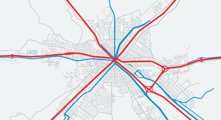 Detailed abstract overhead view of a complex city road map with intersecting red major highways and blue secondary streets on a light grey background. © IMRONI