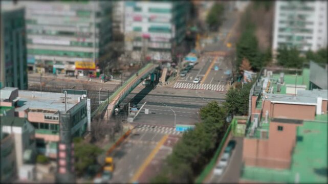 Miniature toy effect of cars moving on a boulevard with a bridge in South Korea