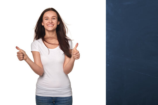 Young White woman adult girl smiling showing double thumbs up in studio isolated background. Concept of approval, success and positive эмо lifestyle