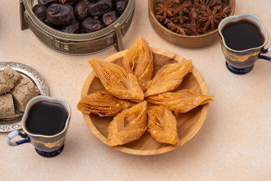 Coffee drink in vintage blue cups with sweets. Food background.