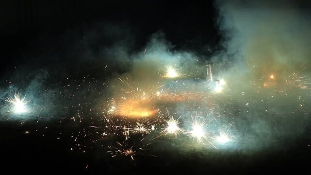 Crackling Ground spinner or indian chakkars fireworks during the Deepavali festival celebration at night time