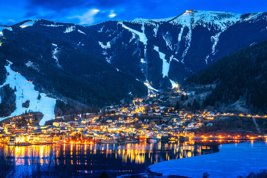 Zell am See, Austria. Zeller See lake and Zell am See under ski slpes evening view