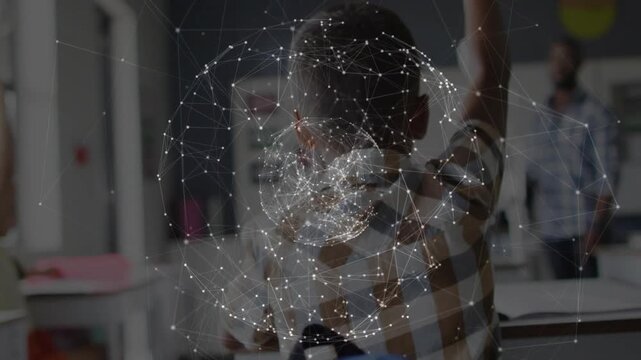 Boy in shirt raising hand in classroom, responding to teacher, network globe overlay rotating