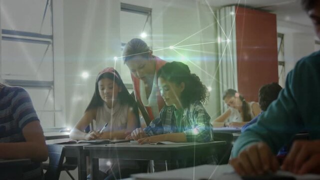 Camera zooming and overlay glowing urging classroom teacher leaning over pair guiding worksheets