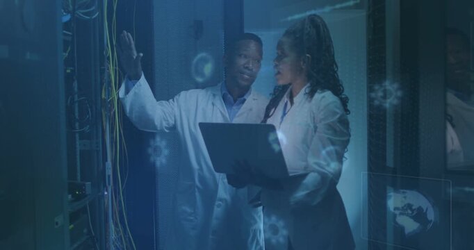 Man pointing to rack, woman using laptop in server row, HUD highlighting cable bundles during check