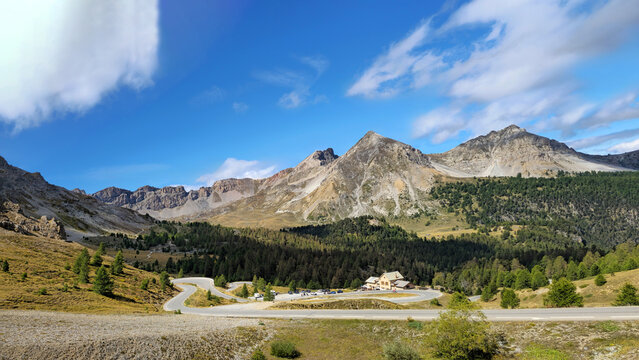 Mountain landscape with winding road at Col d&rsquo;Izoard mountain pass, French Alps, Hautes Alpes, France, Europe.