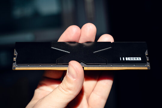Fast DDR5 memory module held in hand.