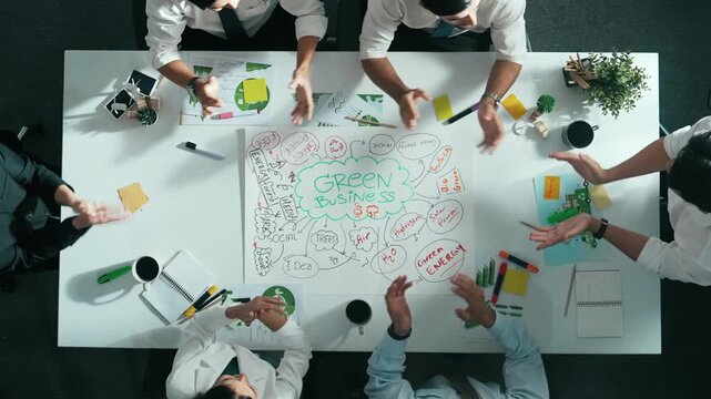 Top view of professional business team working together to brainstorm environmental idea by using mind map. Aerial view of smart manager talking and discussing about sustainable energy. Alimentation.