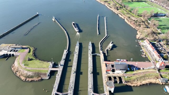 Orange sluices in Amsterdam harbor in Europe