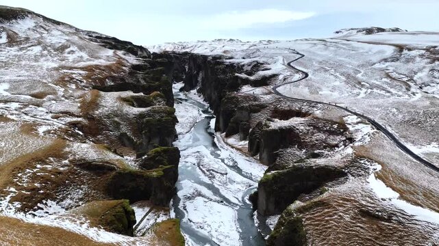 Fja&eth;r&aacute;rglj&uacute;fur Canyon in Snowy Landscape Iceland 4K