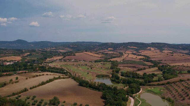 drone footage of rolling hillside landscape of tuscany, italy
