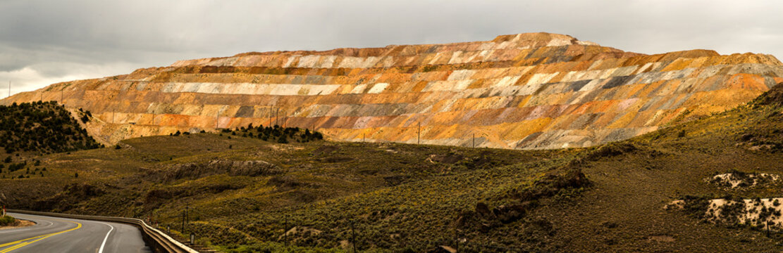 USA, NV, Ely.  Multi colored mine waste piles at large copper mine in the Nevada desert.  