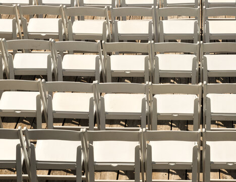 Canada, BC, Vancouver.  Rows of folding chairs.  Awaiting guests at outdoor wedding.