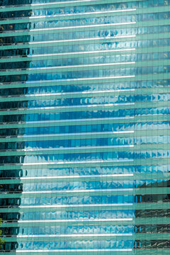 Canada, Alberta, Calgary.  Reflections in the glass of highrise office towers in the financial district.