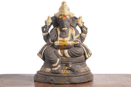 Ganesha idol with gold decoration for home decoration, spiritual blessing and Hindu worship, religious decoration