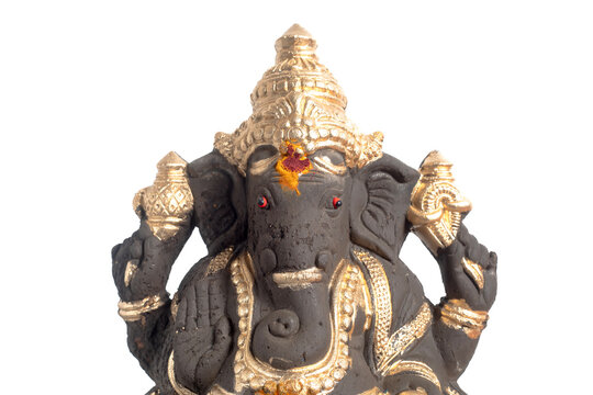 An elegant Ganesha statue adorned in gold, a traditional Hindu deity statue for worship and decoration.