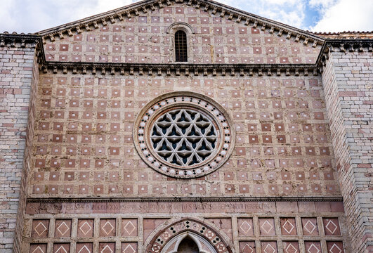 Facade of the Church of San Francesco al Prato, a deconsecrated 13th-century Franciscan church, today an auditorium; its polychrome cosmatesque facade was restored in 1926, Umbria, Italy.