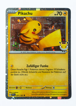 Hamburg, Germany - 06062025: detail shot of the pokemon paper card Pikachu TEF DE Promo from the Pok&eacute;mon Day 2026 with 30th anniversary stamp.