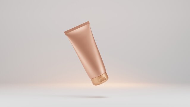 Mockup golden tube with cosmetic cream isolated on white background. Peach blank plastic cream tube mockup for cosmetics with cap. 3D rendering of product , the lotion tube with golden glow. 