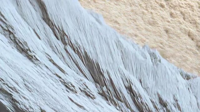Mineral crystals developing a complex, rough texture inside a geological formation, revealing micro details of natural processes shaping surfaces and creating intricate patterns