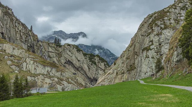 Time lapse, clouds passing over mountains. Mountain landscape near Andermatt, Canton of Uri, Switzerland.