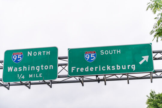 Woodbridge, Virginia street near Washington DC with road sign closeup for highway i95 interstate exit turn to north or south to Fredericksburg