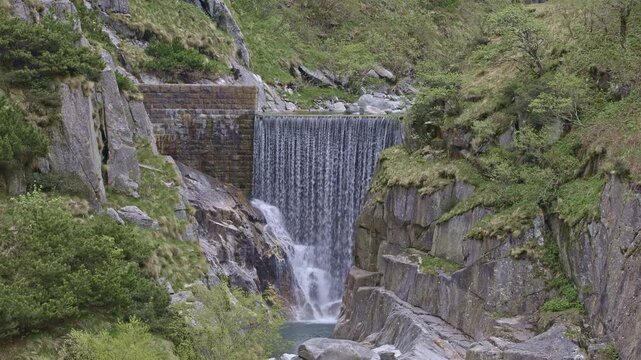 The Reuss man-made cascade in the Schoellenen Gorge, an engineered drop in the river near the Devil&rsquo;s Bridge, Canton of Uri, Switzerland.