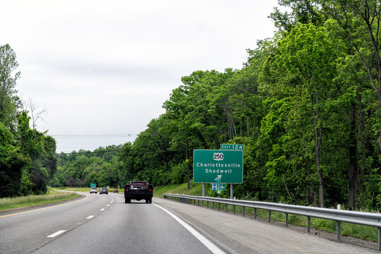 Charlottesville Shadwell road exit sign off Virginia interstate highway i-64 in summer with cars driving in traffic