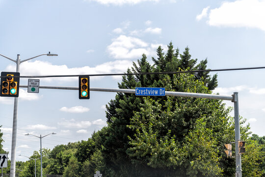 Crestview drive street road sign at intersection with green traffic stoplight light at Fairfax, Virginia residential area