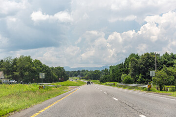 Blue ridge mountains near Virginia US South 29 highway road, cars driving in summer rural countryside village town with scenic landscape