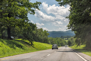 Blue ridge mountains by Virginia US South 29 highway road, cars driving in summer rural countryside scenic landscape